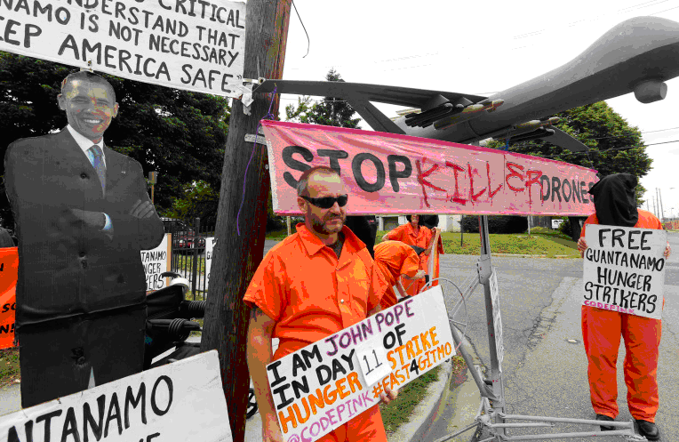 In May 2013, demonstrators stood near a mock drone at the gates of Fort McNair where President Barack Obama was due to speak at the National Defense University in Washington [File: Kevin Lamarque/Reuters]