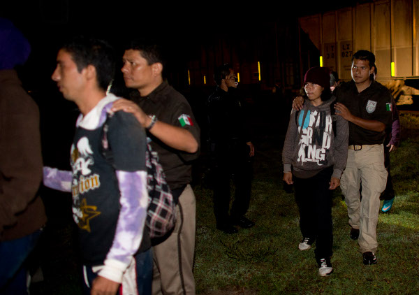 La Migra cops arresting immigrant youth for deportation, August 2014.